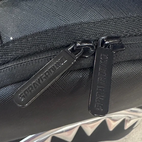 Sprayground limited edition Black Backpack with Silver Shark Design